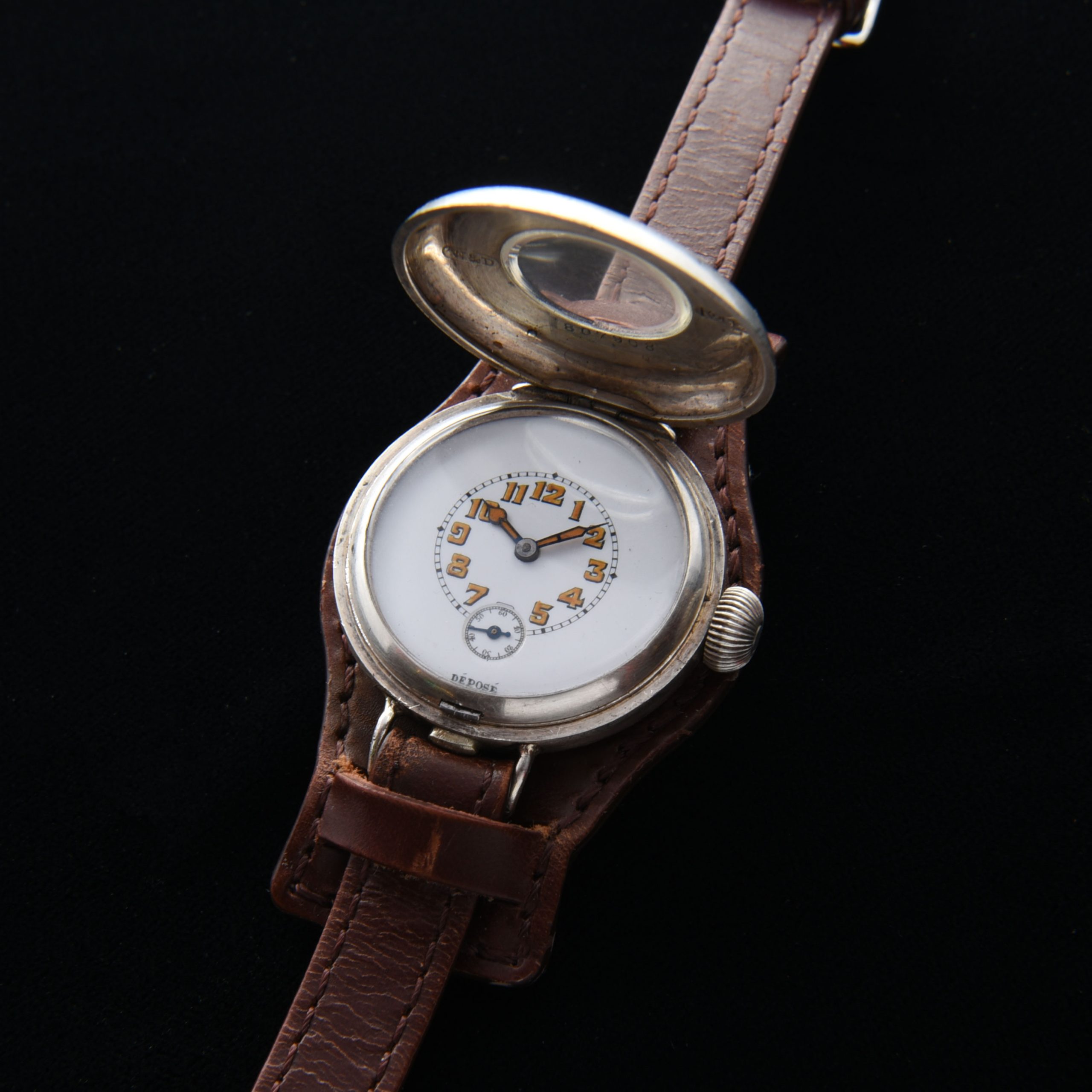 This is a very rare WW1 era 1917 vintage Rolex Sterling-Silver-half-hunter-hinged-case watch measuring a large 35mm and looking incredible! The case is all properly signed "Rolex". The Sterling-silver case with enamel-inset numerals has survived amazingly well; remaining in fabulous condition.