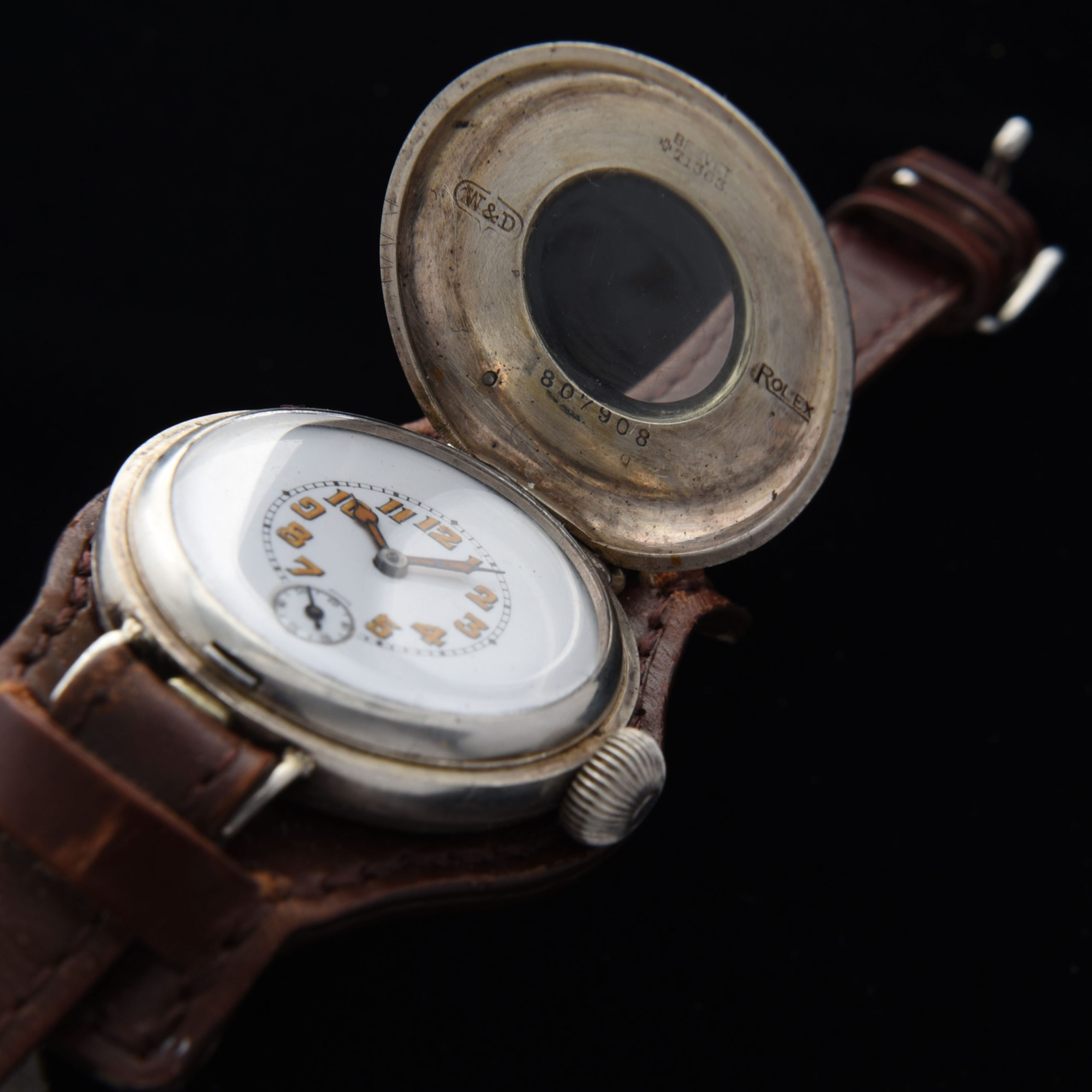 This is a very rare WW1 era 1917 vintage Rolex Sterling-Silver-half-hunter-hinged-case watch measuring a large 35mm and looking incredible! The case is all properly signed "Rolex". The Sterling-silver case with enamel-inset numerals has survived amazingly well; remaining in fabulous condition.